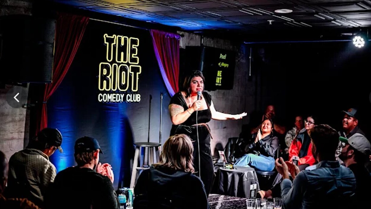 A comedian mid set on the main stage upstairs
