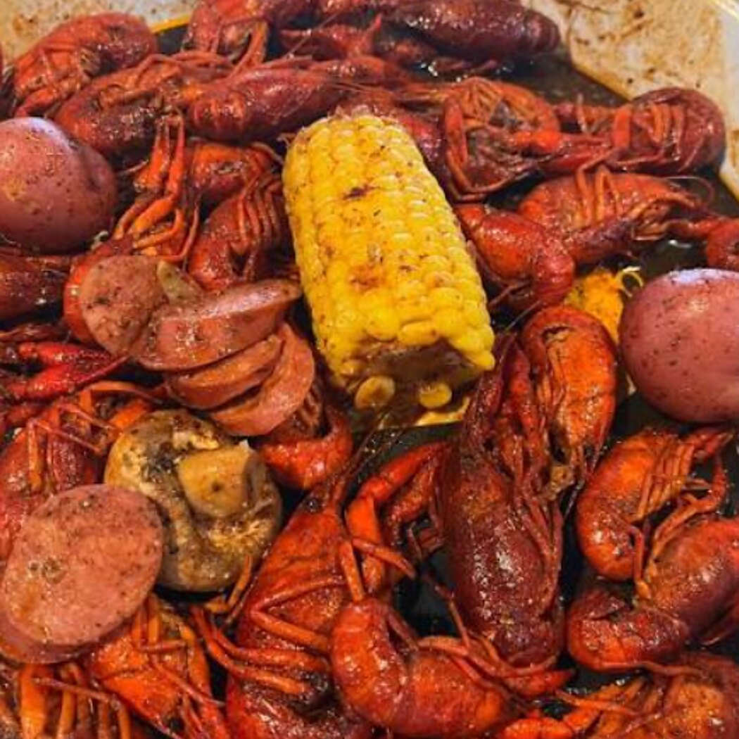 A crawfish boil with corn, sausage and red potatoes