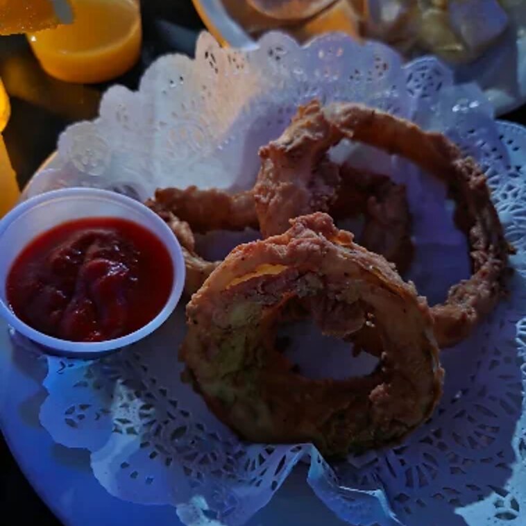 Hand battered onion rings with cocktail sauce